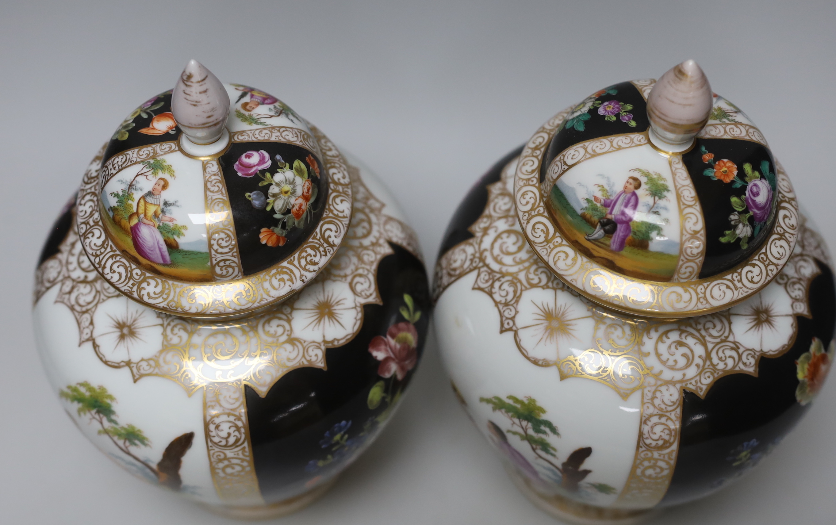 A pair of Dresden vases and covers and two Doulton figures, tallest 26cm